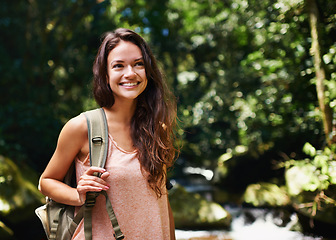 Image showing Nature, happy and woman hiking with backpack for outdoor adventure trail on vacation. Smile, travel and female person with bag for trekking in forest, field or woods on holiday or weekend trip.