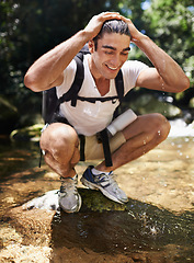 Image showing Travel, trekking and wet man by water for adventure, vacation or holiday with backpack in Colombia. Nature, forest and young male person hiking with bag by lake for refresh in woods on weekend trip.