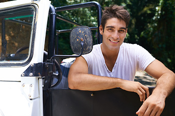 Image showing Man, road trip and portrait in forest, happy and outdoor for drive, safari and vacation in summer. Person, pride and relax by car, transportation or journey in tropical jungle on holiday in Colombia