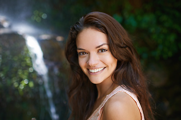 Image showing Smile, waterfall or portrait of happy woman in forest or wilderness for outdoor trekking adventure. Park, face or female hiker walking in woods or nature for travel, exercise or wellness on holiday