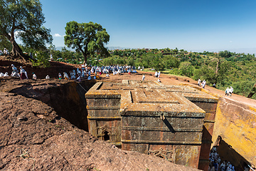 Image showing Orthodox christian Ethiopian people behind famous rock-hewn church, Lalibela Ethiopia people diversity,