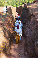 Image showing Orthodox christian Ethiopian people behind famous rock-hewn church, Lalibela Ethiopia people diversity,