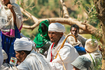 Image showing Orthodox christian Ethiopian people behind famous rock-hewn church, Lalibela Ethiopia people diversity,