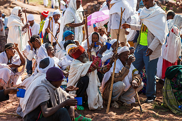 Image showing Orthodox christian Ethiopian people behind famous rock-hewn church, Lalibela Ethiopia people diversity,