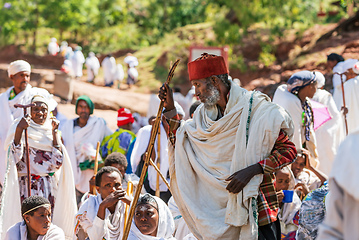 Image showing Orthodox christian Ethiopian people behind famous rock-hewn church, Lalibela Ethiopia people diversity,