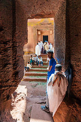 Image showing Orthodox christian Ethiopian people behind famous rock-hewn church, Lalibela Ethiopia people diversity,