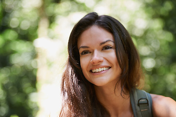 Image showing Hiking, face or happy woman with smile in forest or wilderness for a trekking adventure. Woods, travel or excited female hiker walking in a natural park or nature for exercise or wellness on holiday