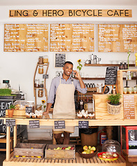 Image showing Portrait, smile and phone call with black man in cafe for communication, networking or service. Coffee shop, restaurant and small business with happy young store owner or vendor working in bakery