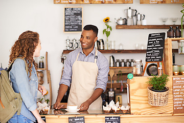 Image showing Coffee, smile and barista serving woman in bakery, cafe or deli for small business retail or food industry. Diversity, startup or bistro and man server or waiter in restaurant with customer for order