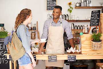 Image showing Coffee shop, small business and barista serving customer in bakery, cafe or deli for retail or food industry. Smile, startup or bistro and happy man server or waiter in restaurant with woman consumer