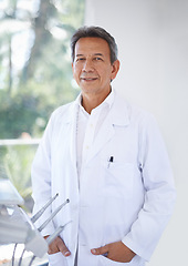 Image showing Senior dentist, man in portrait and dental for teeth whitening and orthodontics with oral health at practice or clinic. Healthcare, medical professional and expert orthodontist with service for mouth