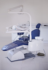 Image showing Dental, chair and healthcare at dentist office, medical equipment or furniture for oral health and wellness. Orthodontics, dentistry and treatment workspace for mouth care at orthodontist clinic