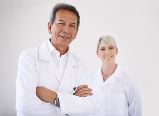 Image showing Portrait, dentist and woman in clinic together with confidence, expert advice and orthodontics for medical health. Dental medicine, healthcare and professional with pride, arms crossed and technician