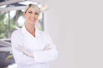 Image showing Portrait, dentist and doctor woman in clinic with confidence, expert advice and orthodontics for medical health. Dental medicine, healthcare and professional with pride, arms crossed and oral service