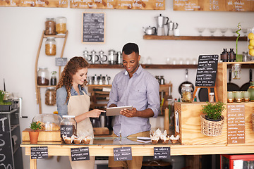 Image showing Collaboration, small business shop and tablet with owner in coffee shop together for planning or service. Teamwork, technology for ecommerce or online order with man and woman in cafe or restaurant