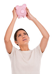 Image showing Stress, debt or woman in studio for piggy bank, crisis or budget, savings or payment fail on white background. Economy, inflation or frustrated model with empty cash container, disaster or bankruptcy