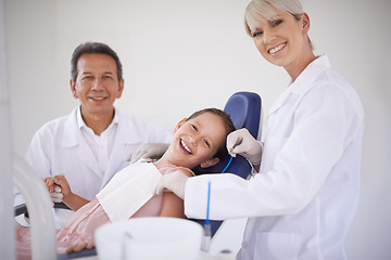 Image showing Portrait, dentist and technician with child in clinic for expert advice, orthodontics and medical health. Dental medicine, healthcare and professional man with girl, woman and oral service in office
