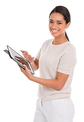 Image showing Woman, tablet and portrait in studio for online, research and e learning on college website. Smile of a student or model typing, scroll and education on digital technology and a white background
