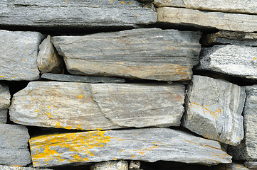 Image showing Close-up view of a dry stone wall displaying various textures an