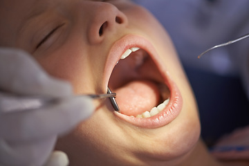 Image showing Teeth, child and dentist with tools in mouth for gum disease and oral hygiene with dental inspection. Medical, orthodontics and patient consultation for health, cleaning and wellness with instruments