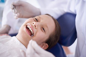 Image showing Girl, child and hands with tools for dental, gum disease and oral hygiene with mouth inspection and face. Medical, orthodontics and consultation for teeth health, happiness or wellness with excavator
