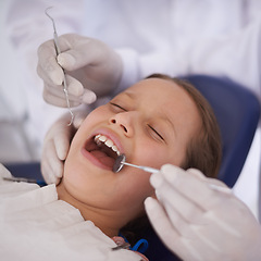 Image showing Girl, child and hands with mirror for dental, gum disease and oral hygiene with mouth inspection and face. Medical, orthodontics and consultation for teeth health, cleaning or wellness with excavator