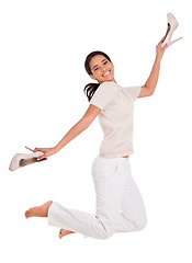 Image showing Excited, jump and portrait of happy woman in studio with news, sale or shoes discount on white background. Wow, energy or female model with deal celebration, freedom or retail, shopping or mall promo