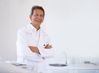 Image showing Portrait, dentist and doctor man in office with confidence, expert advice and orthodontics for medical health. Dental medicine, healthcare and professional with pride, arms crossed and oral service.