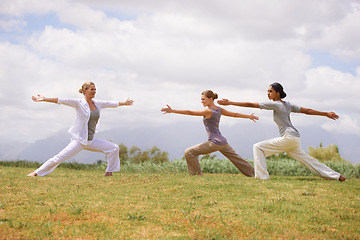 Image showing Group, women and yoga instructor in warrior pose outdoor for healthy body, exercise or fitness. Teacher, virabhadrasana and people in nature for balance, stretching and holistic practice for wellness