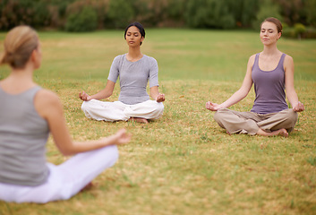 Image showing Lotus, group and meditation outdoor for yoga, healthy body and mindfulness exercise to relax. Peace, zen and calm women in padmasana in nature for balance, spirituality or breathing with instructor