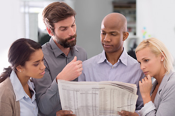 Image showing Business people, newspaper and thinking in team building for information, crossword game or search at office. Group of employees with document or paperwork in planning or problem solving at workplace