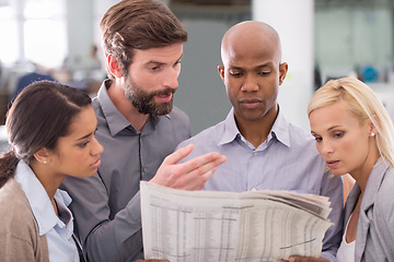 Image showing Business people, newspaper and reading in team for information, stock market or search at office. Group of employees with document or paper for finance, planning or investment review at workplace