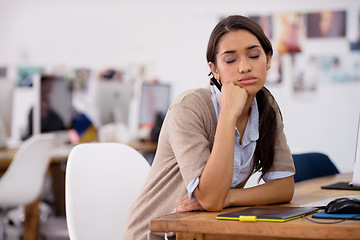 Image showing Woman, tired and sleep at desk for overworked as search editor for production company, stressed and working. Female person, computer and bored at job, fatigue and depressed with bad mental health