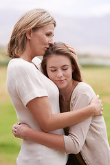 Image showing Mother, daughter and hug with care outdoors in nature for mothers day, love and affection for gratitude. Mom, teenage child and bonding together on summer vacation for support, smile and relationship
