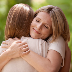 Image showing Parent, daughter and hug with support outdoors in nature for mothers day, care and affection for gratitude. Mom, girl child and bonding together on summer vacation for love, smile and closeup