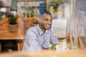 Image showing Happy, friends and man in window at cafe for brunch together on holiday or vacation in Mexico. Person, smile and talk to people in coffee shop with funny conversation at lunch with espresso or latte