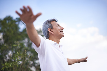 Image showing Mature man, freedom and thinking in outdoors, relax and daydreaming in countryside or park. Happy male person, profile and fresh air for mindfulness on holiday or vacation, peace and travel in nature