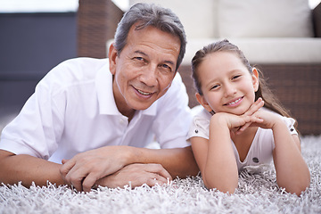 Image showing Happy, portrait and grandpa with girl in home on holiday or vacation together in retirement with smile. Senior, man and grandparent relax with child on floor in living room and bonding in Mexico