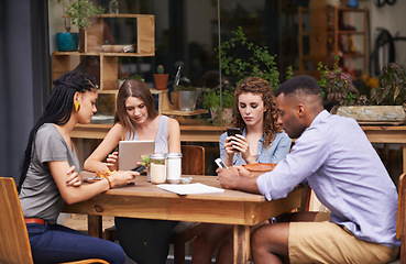 Image showing Technology, diversity and friends in restaurant together for social gathering with phone, tablet and networking. Coffee shop, brunch and people relax at sidewalk cafe with text, email or digital app.