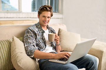 Image showing Man, portrait and laptop on sofa with coffee as freelance journalist for online research, connectivity or networking. Male person, couch and internet for remote work in London, communication or web