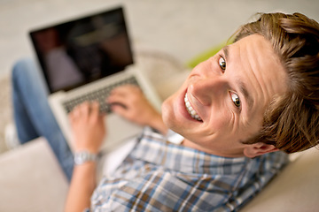 Image showing Man, portrait and laptop on sofa for online as freelance journalist for report research, connectivity or networking. Male person, above and internet for remote work in London, communication or web