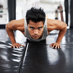 Image showing Mexican man, strong and training for fitness, sport and health for boxer on mat with pushups. Male person, wellness and exercise for workout, athlete and cardio strength for commitment in boxing gym