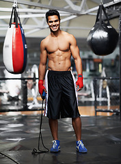Image showing Man, portrait and equipment in gym for boxing, training and keeping fit for competition. Male person, mma fighter and exercise in fitness centre for wellness, health and maintain strength for match