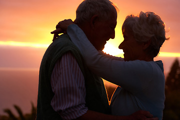 Image showing Sunset, elderly couple and hug outdoor, love and bonding for connection together in nature. Man, woman and embrace for care, romance and support for commitment to relationship in retirement on date