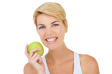 Image showing Woman, portrait and green apple in studio for diet, wellness or fitness on white background, mockup or backdrop. Model, dietician or nutritionist with healthy fruit for vitamins, cleanse and workout