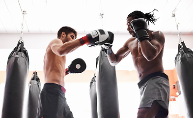 Image showing Men, boxer and training competition with gloves in gym or endurance practice for champion, challenge or fighting. Male people, opponents and punch for battle sport with muscle action, exercise or fit