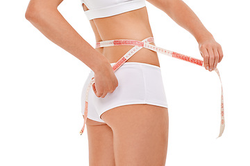 Image showing Woman, wellness and tape measure for health, fitness and studio for workout and body care with weight loss. Female person, waist and white background for diet, results and natural in underwear