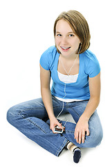 Image showing Teenage girl listening to music