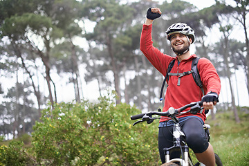 Image showing Fitness, success and man cycling in countryside for adventure, discovery or off road sports hobby. Exercise, winner and celebration with young cyclist on bike in nature for cardio training or workout