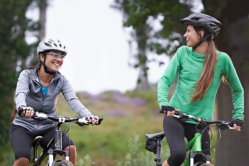 Image showing Happy woman, friends and forest with bicycle on field for outdoor cycling, workout or cardio exercise in nature. Female person, athlete or cyclist with smile in fitness for off road training on trail